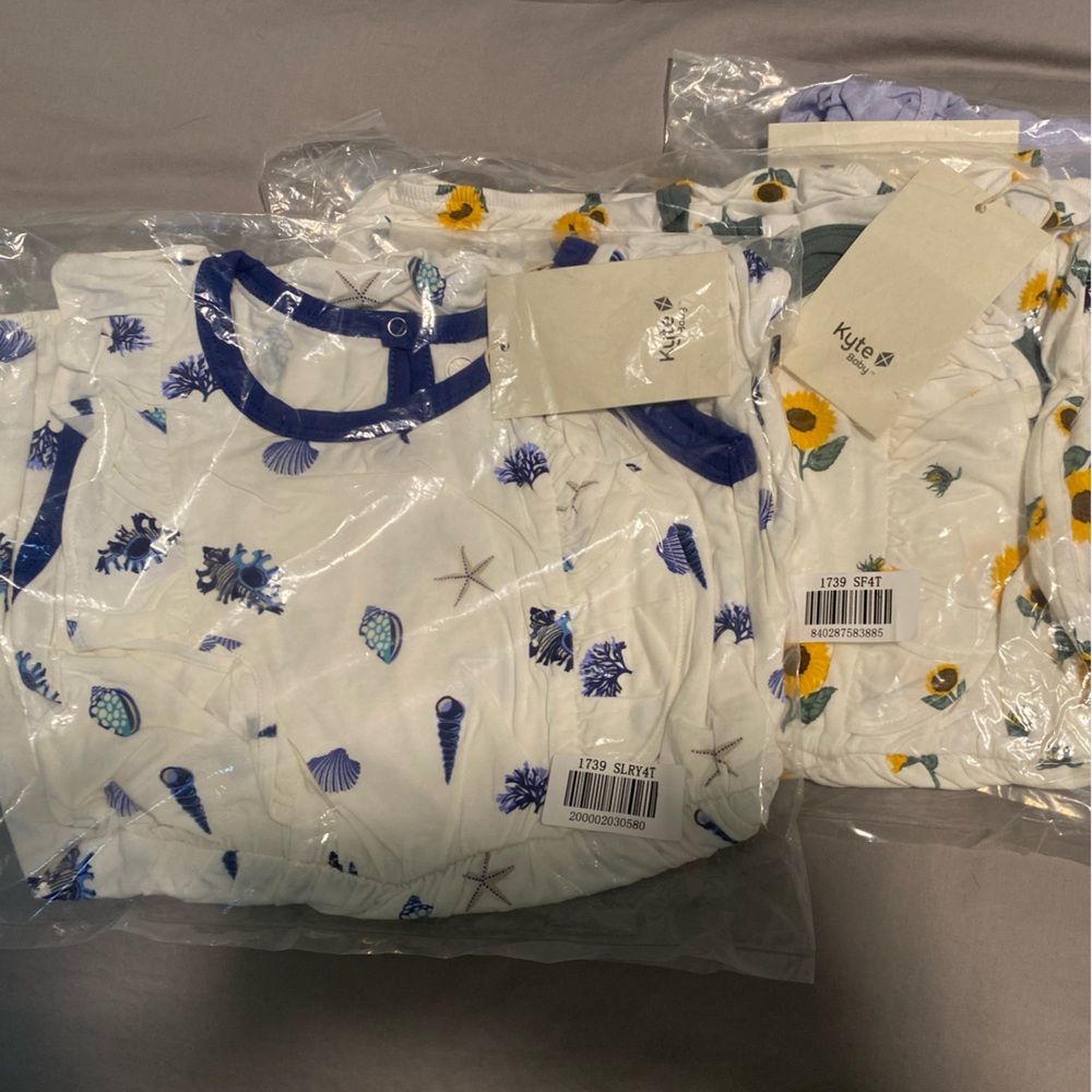 KYTE royal shell and sunflower bubble rompers